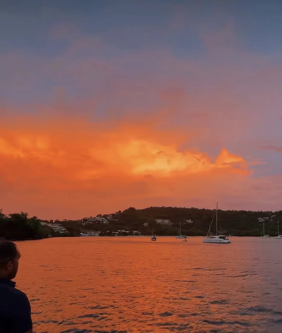 An orange sunset over the bay on the Flavours of Grenada Sea Fari dinner cruise