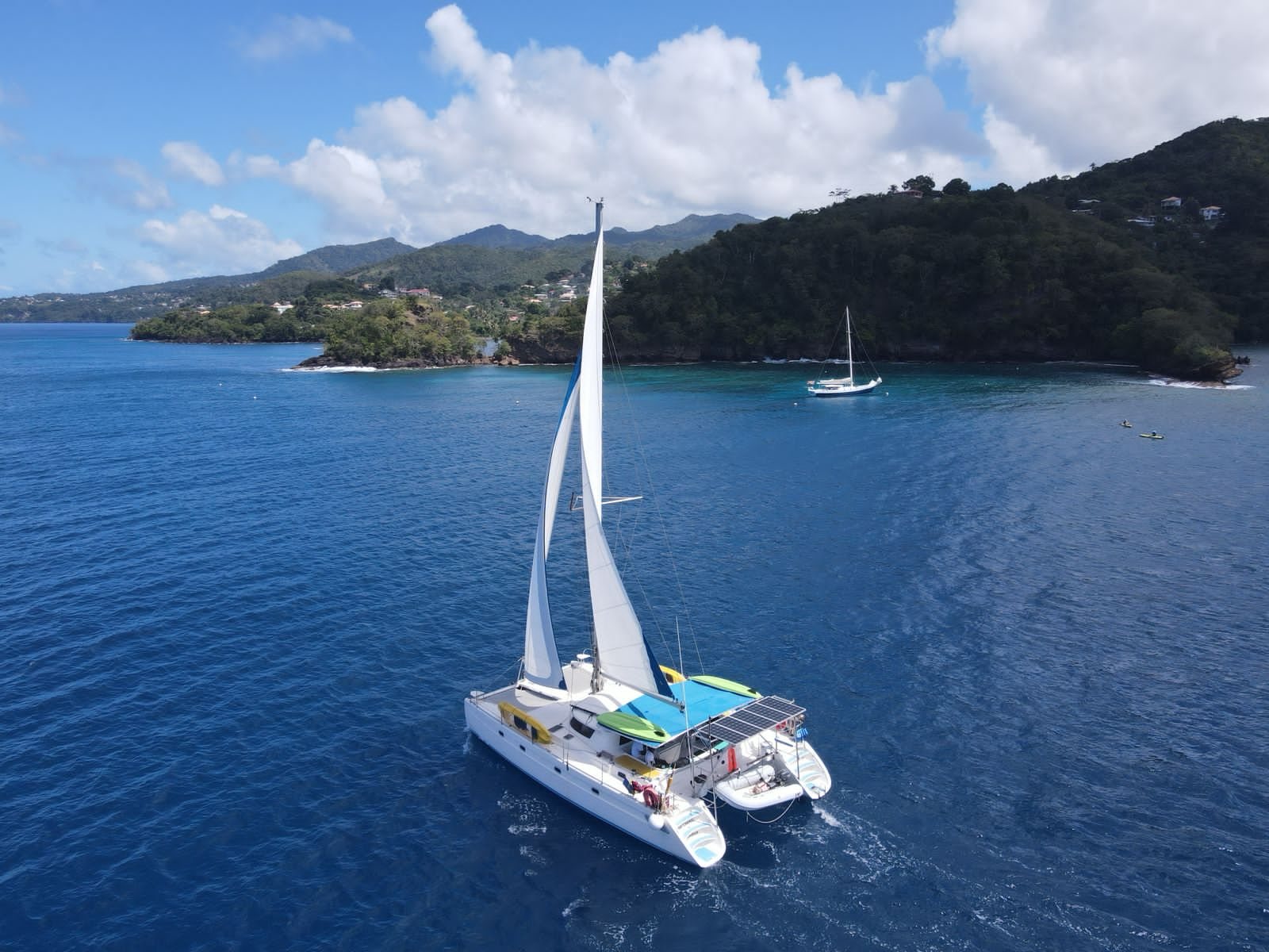 Bacchanal sailing catamaran off the Grenada coast, seen from above