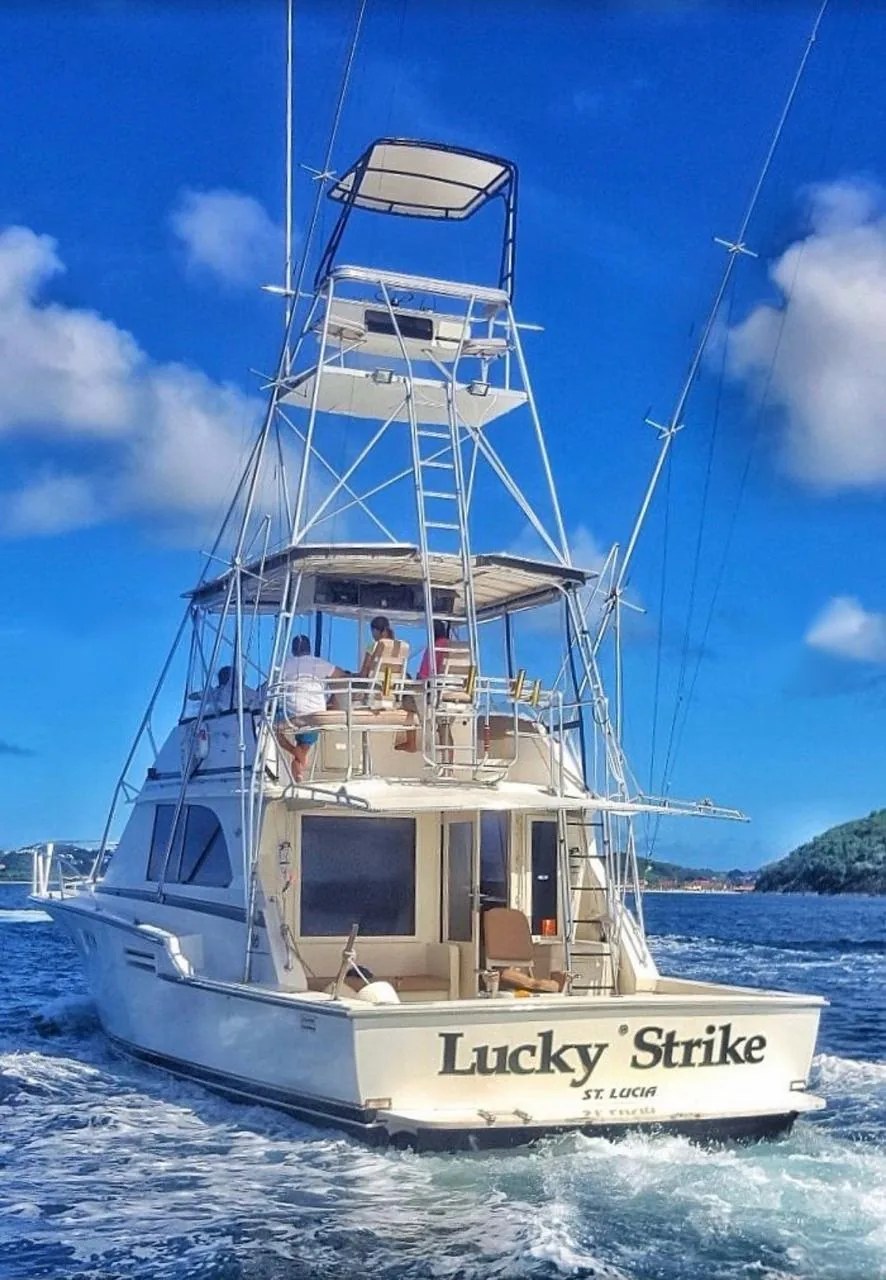 The Lucky Strike from astern, with her tower and guests on the flybridge