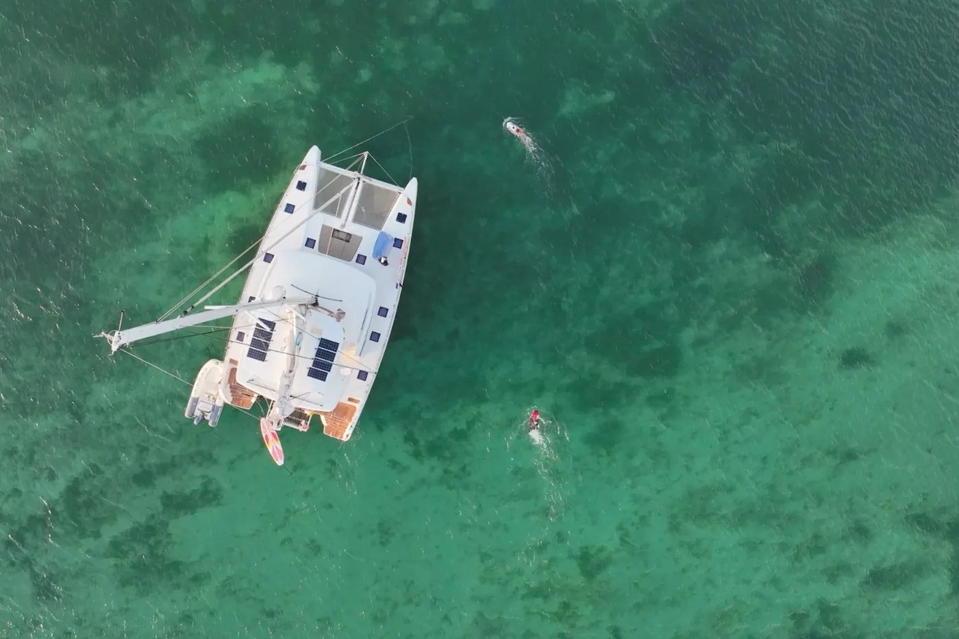 Sail Away catamaran seen from above over clear green water off Grenada