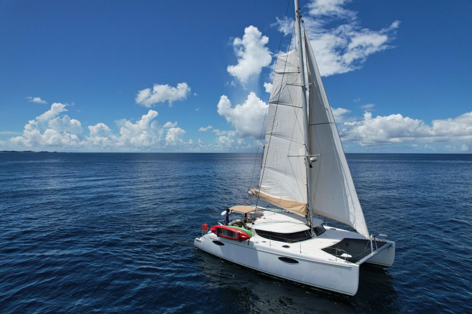 Spice Princess sailing off Grenada with kayaks on deck